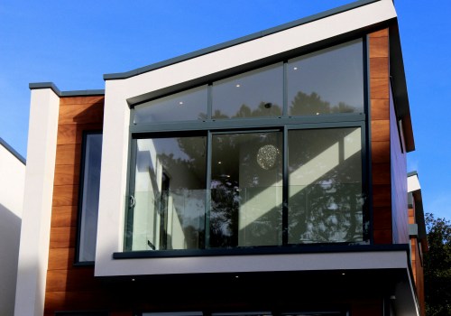 Enhancing Coastal Homes with Residential Glass Services While Planning Roof Replacement in Mississippi Gulf Coast